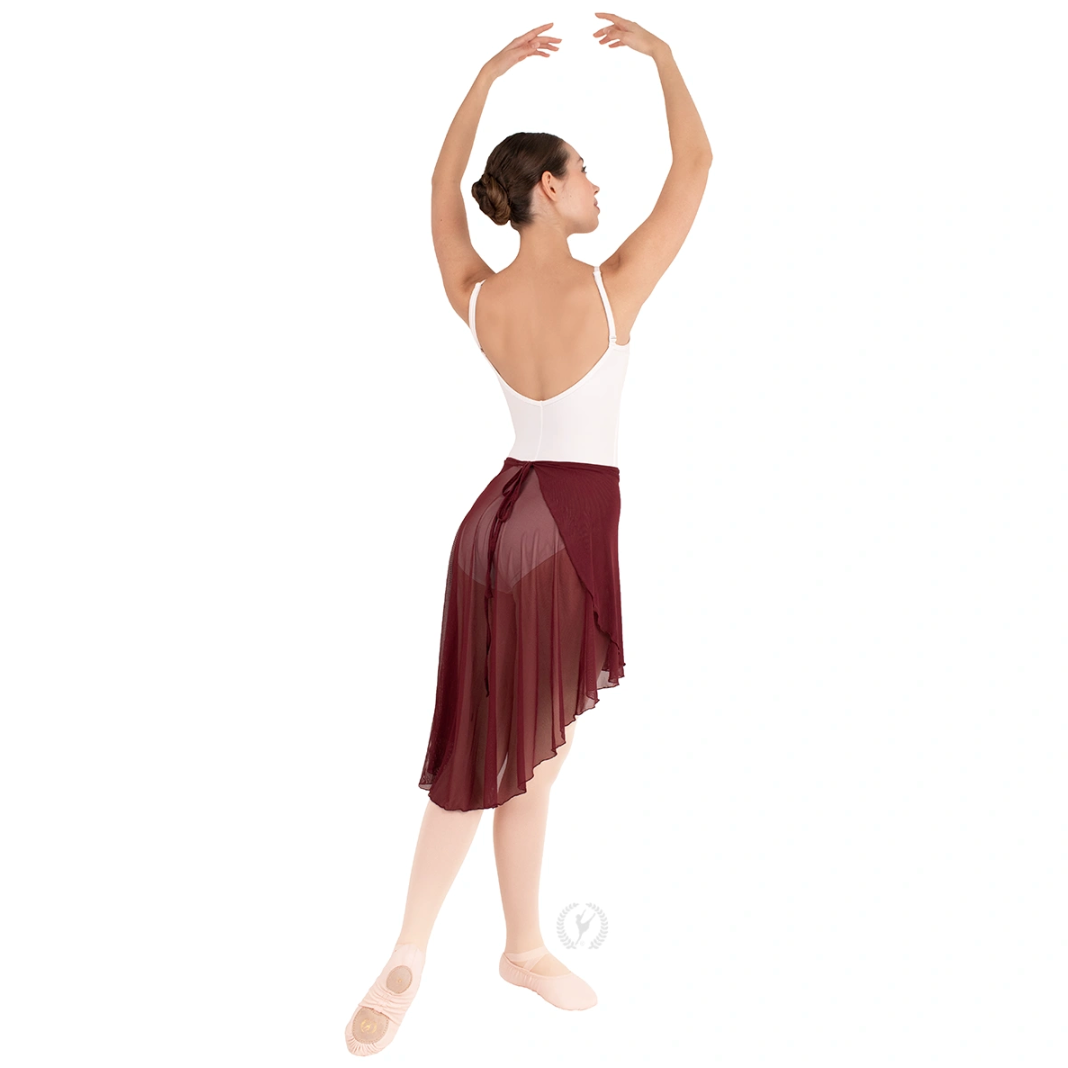 A dancer is shown from the back, wearing a white leotard and a dramatic maroon mesh wrap skirt. The high-low design of the skirt features a shorter front and longer back, with matching mesh ties at the waist.