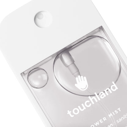 The image features a clear, minimalist bottle of Touchland Unscented Power Mist Hydrating Hand Sanitizer.