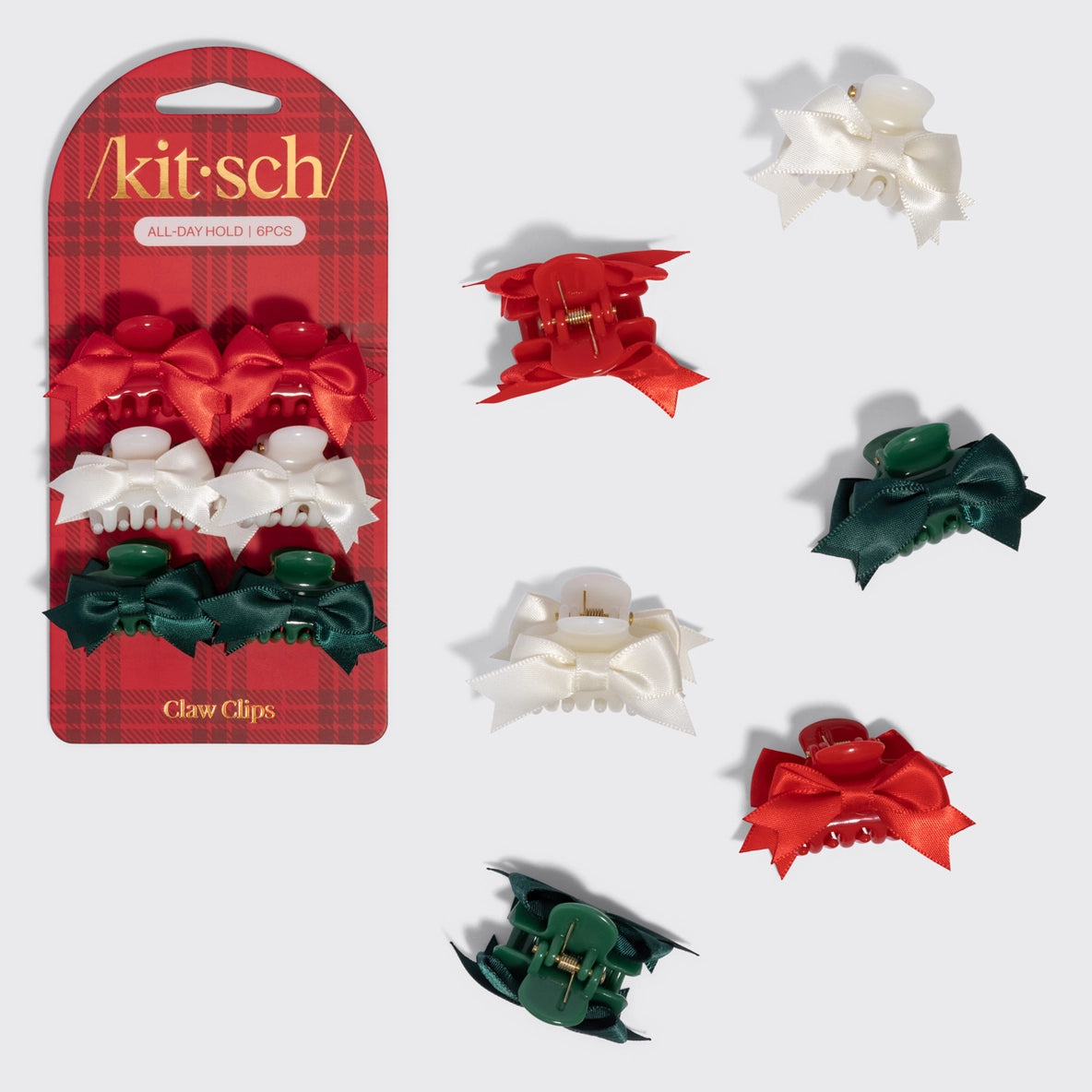 The image features a set of six mini claw clips from the brand Kit-sch, arranged on a festive plaid background.