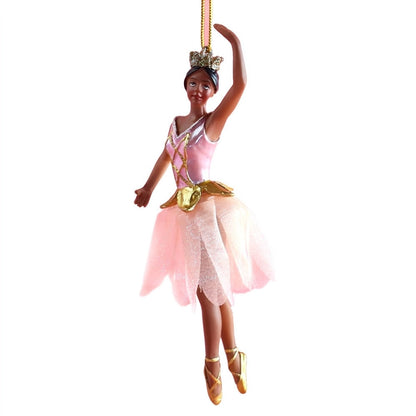 A beautiful ornament featuring a ballerina dressed in a pink fabric tutu and a sparkling tiara. This graceful figure, poised on pointe with arms elegantly raised, showcases intricate details.