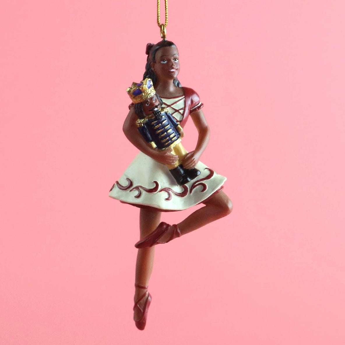 This image features a detailed ornament of Clara on pointe, part of the Clara on Pointe with Nutcracker collection by an unspecified brand.