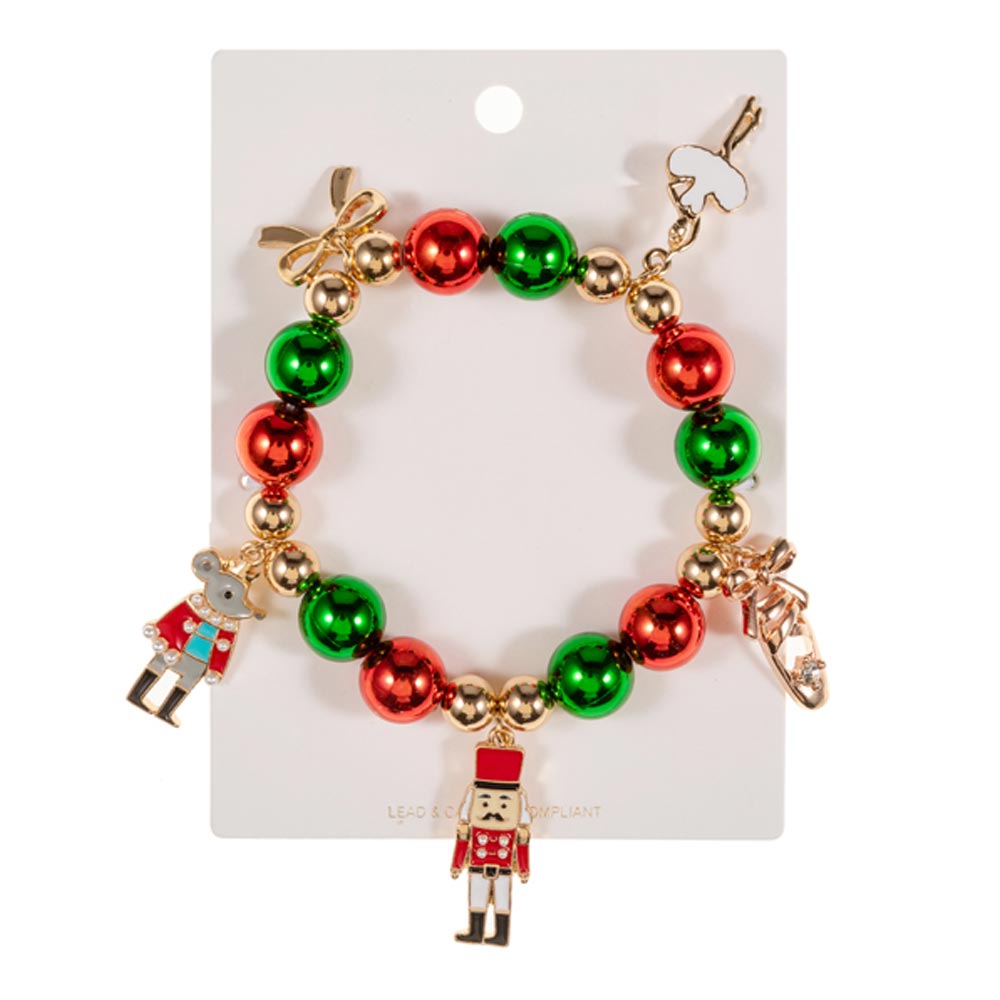 A festive Nutcracker Bow Charm Beaded Stretch Bracelet features alternating red and green beads, accented with gold beads.