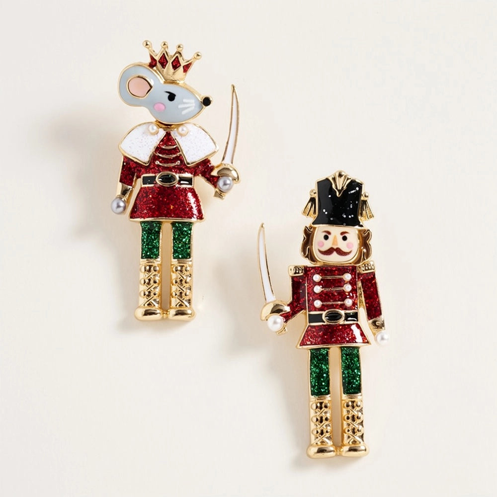 This image showcases a pair of whimsical earrings featuring a Nutcracker and a Mouse King, each adorned with vibrant glitter and festive details.