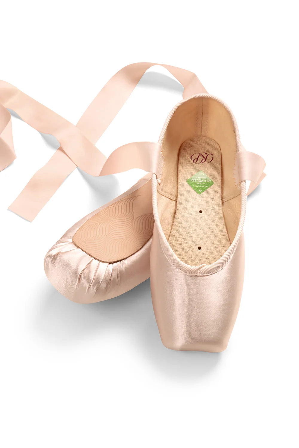 The image features a pair of Akoya pointe shoes in a soft, light pink color, positioned with the left shoe facing upward and the right shoe slightly angled.