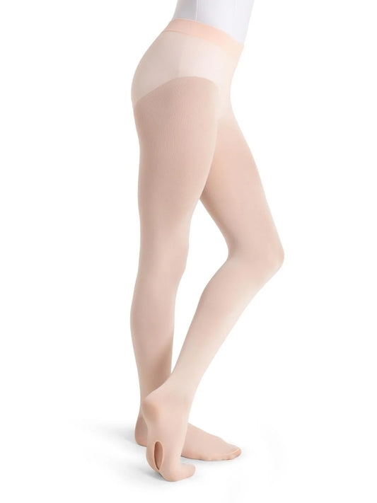 The image features a pair of Girls Ultra Soft™ Transition® Tights in a soft nude color, elegantly displayed on a model in a side profile position.