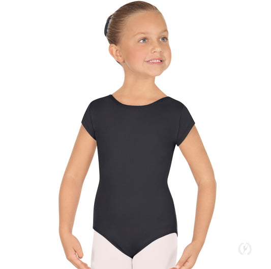 A young girl smiles while wearing a black short sleeve leotard, featuring a moderate scoop neck and scoop back.
